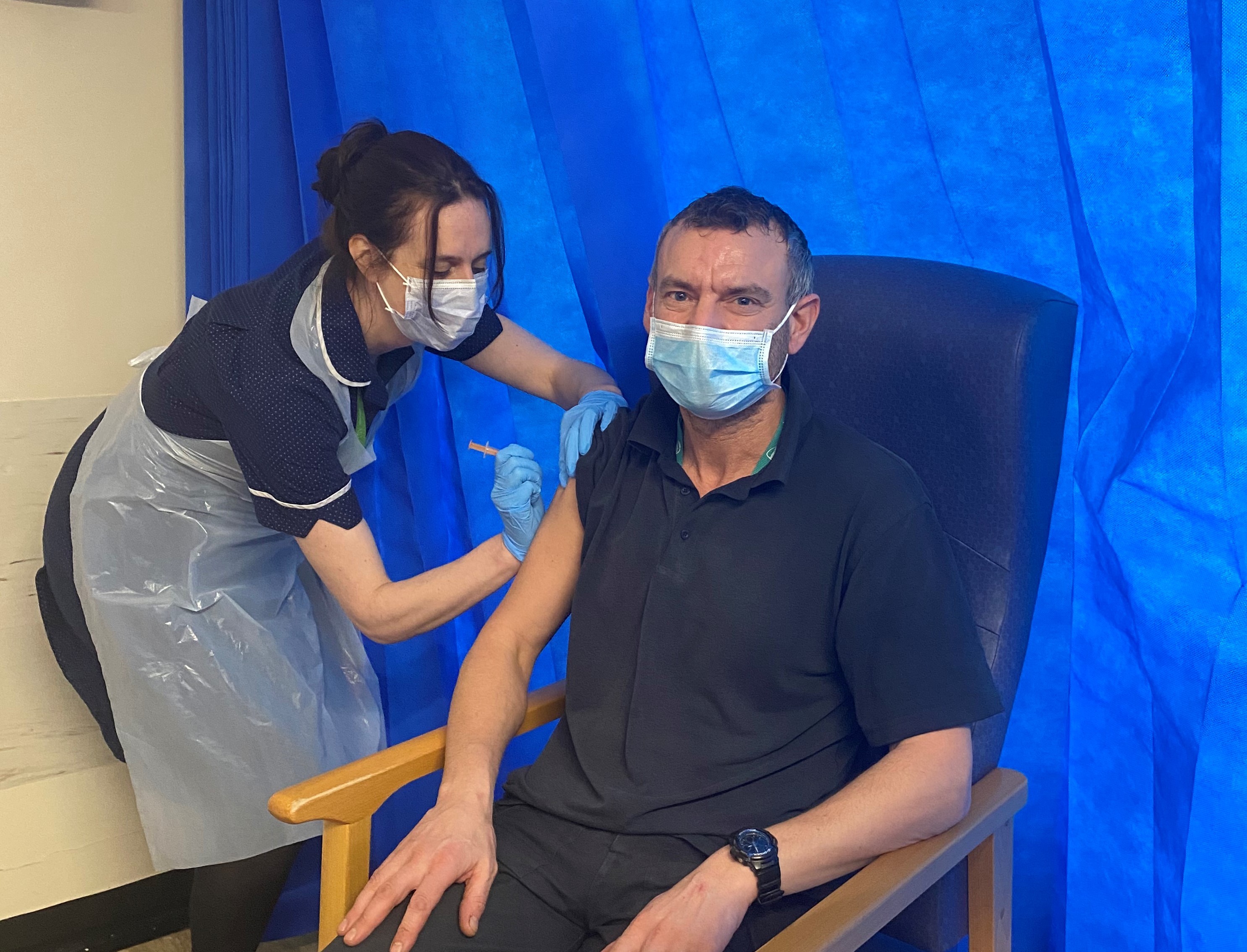 Clive Cwaczko Electrical Tradesman WGH receiving his Oxford vaccination UHMBT 2.jpg