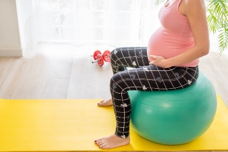 Pregnant woman on an exercise ball.jpg