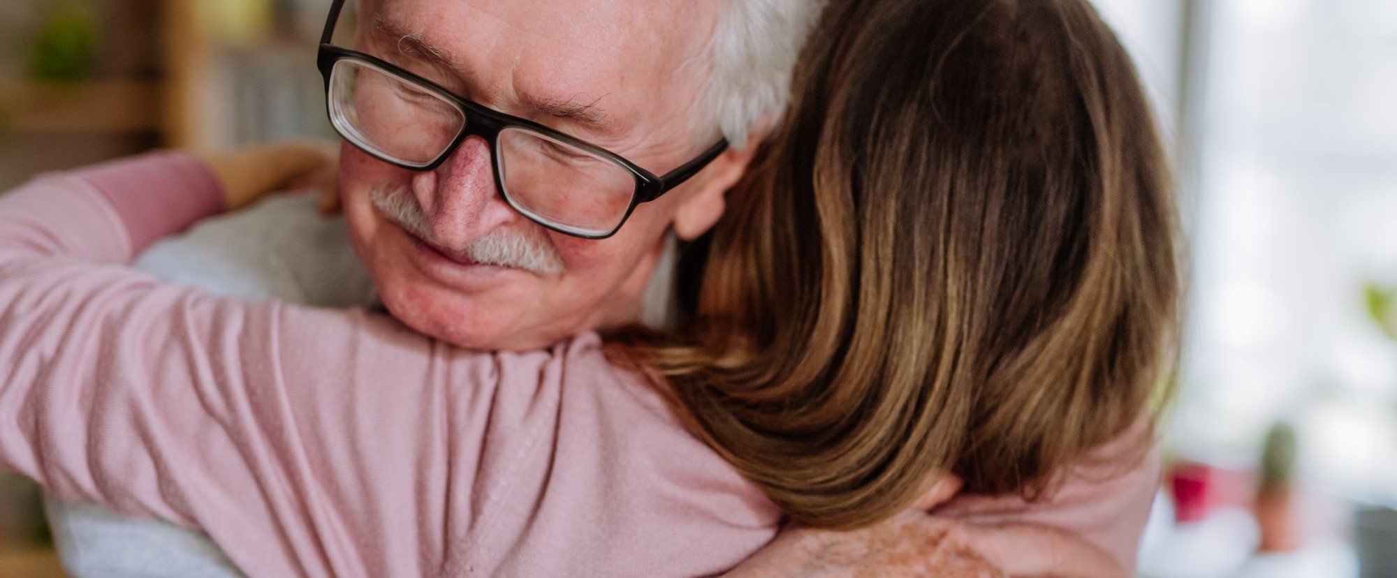 Image of an older man and woman hugging.jpg