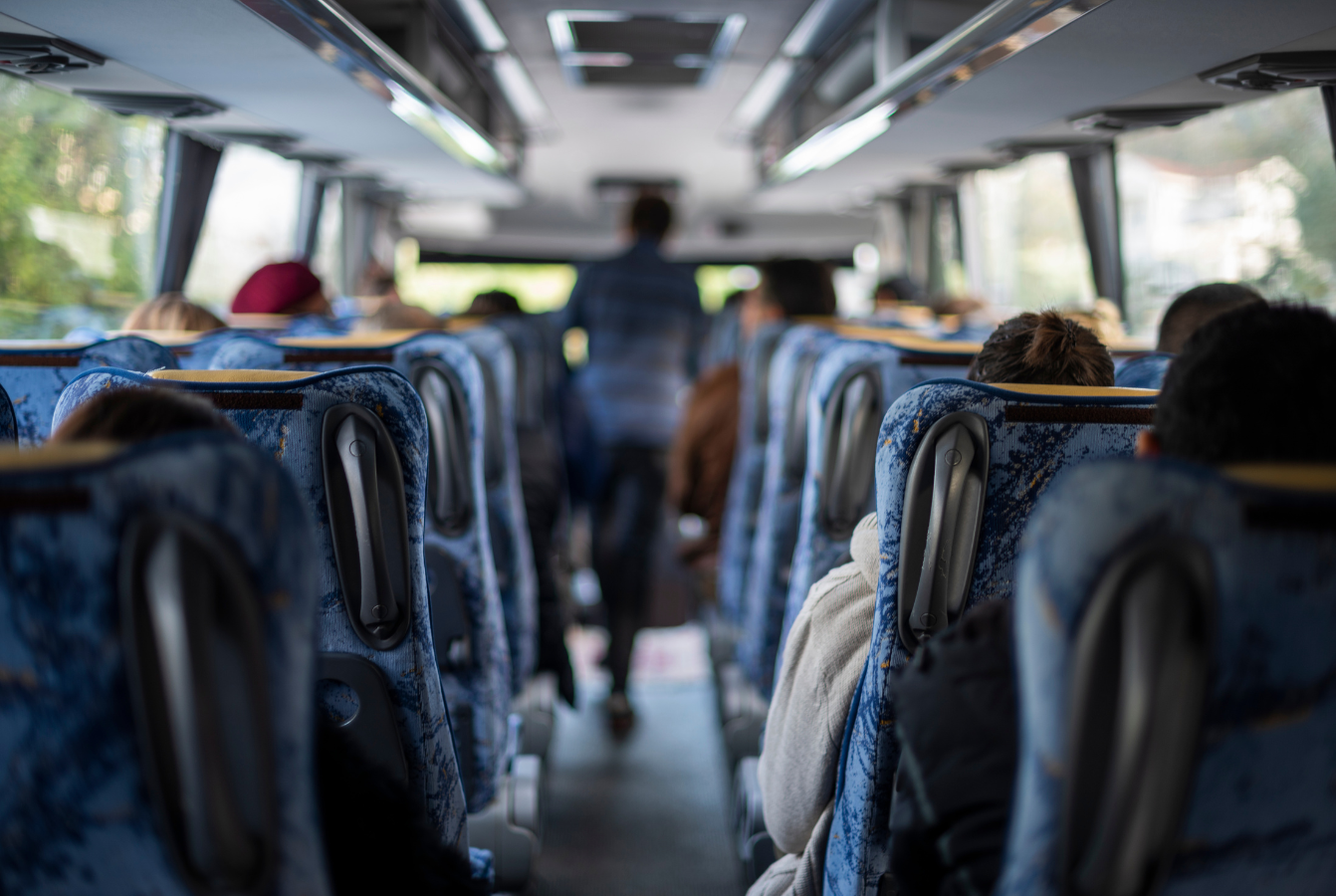 Stock image of people on a bus.png