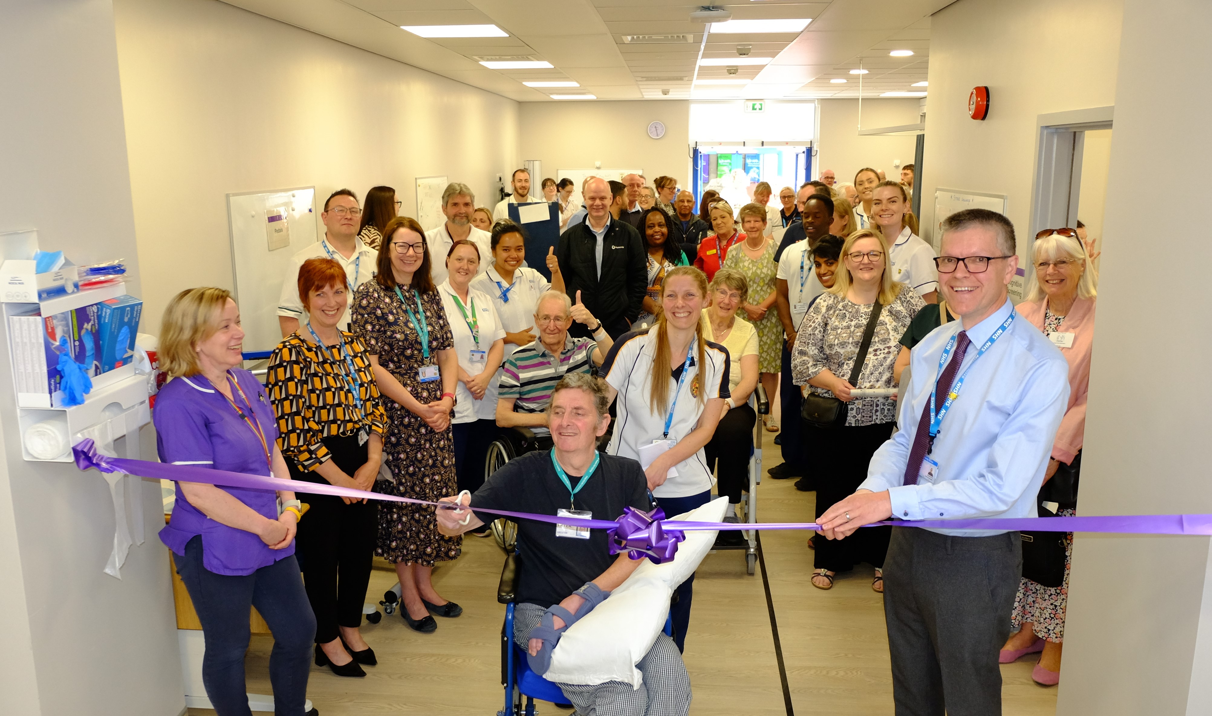 Peter Whitehead cutting the ribbon Stroke Rehab Space UHMBT 2023.jpg