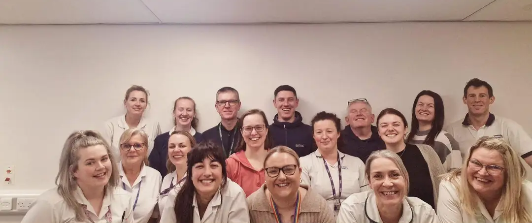 Group photo of stroke service colleagues smiling to camera