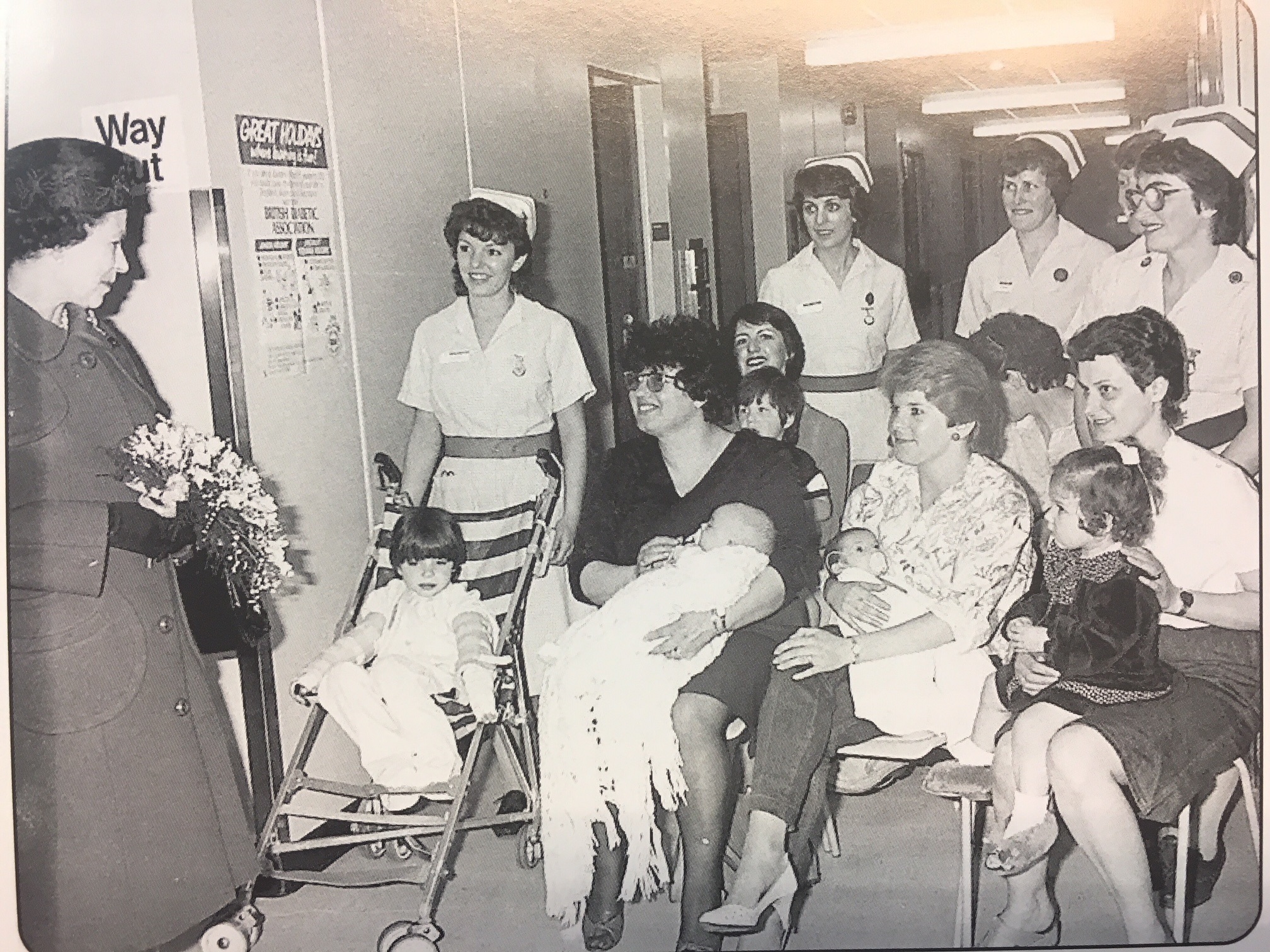 Black and white photograph of HRH Queen Elizabeth the second visiting the Furness General Hospital Children's Ward in 1985