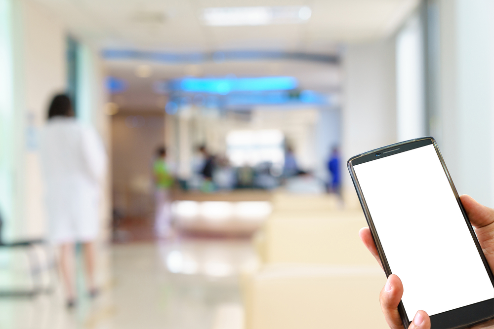 Shutterstock image of a phone in hospital setting