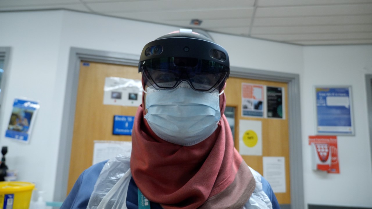 A member of staff wearing the HoloLens 2 headset.jpg