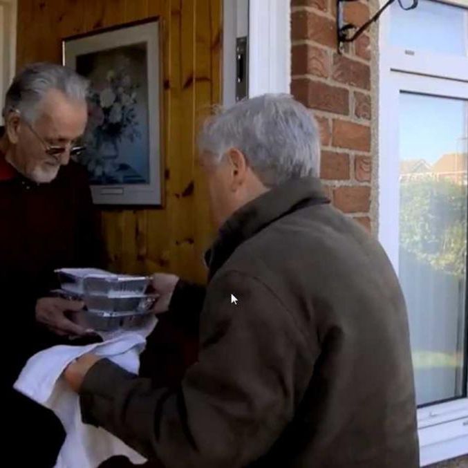 A resident receives Meals on Wheels in Barrow.jpg