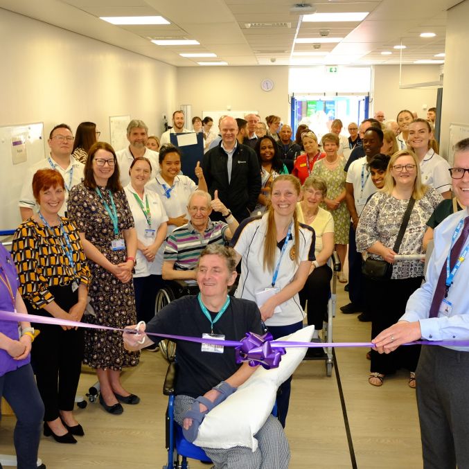 Peter Whitehead cutting the ribbon Stroke Rehab Space UHMBT 2023.jpg