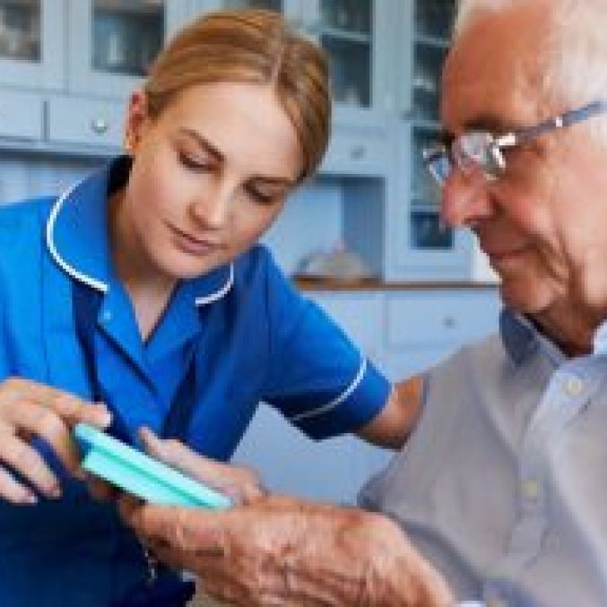 Stock image of nurse and elderly man